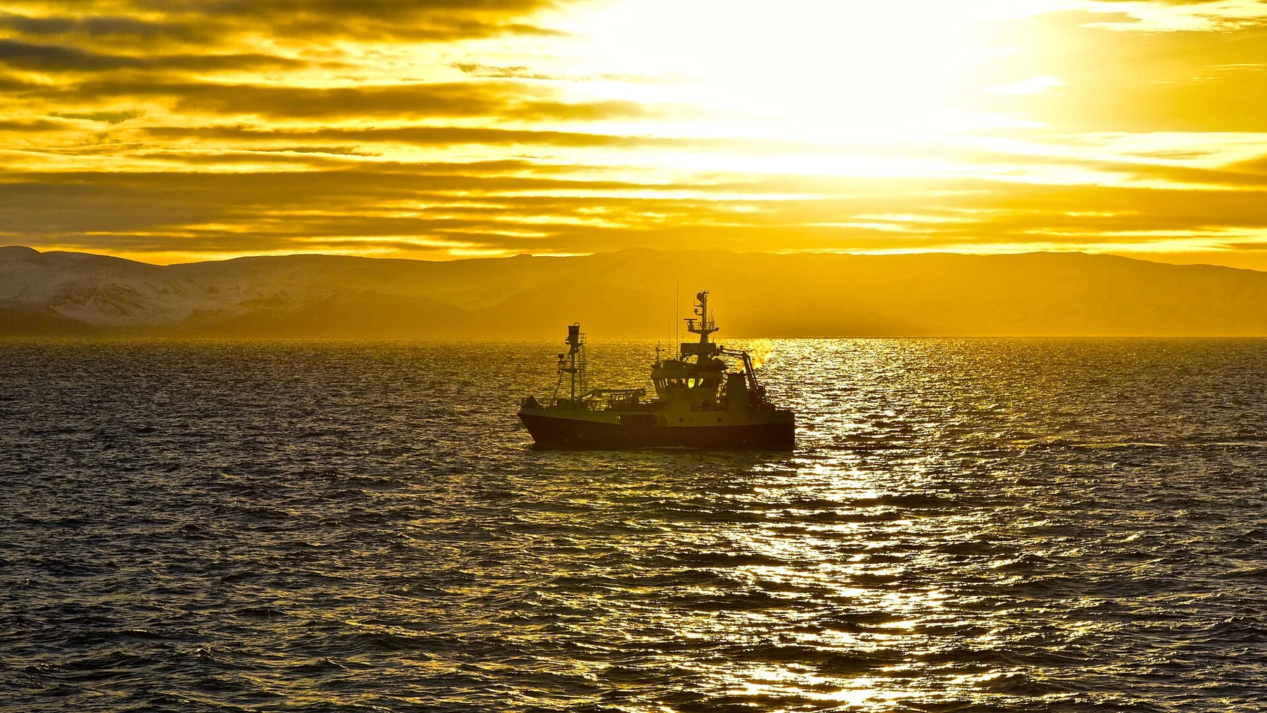 Fishing boat moving through Finnmark waters