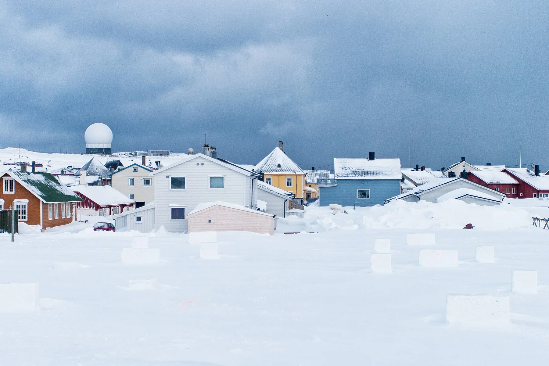 Snow-covered Vardø beside the dark winter sea